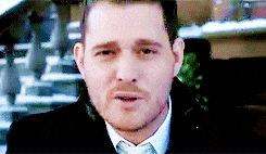 Michael Buble blowing snow at the camera