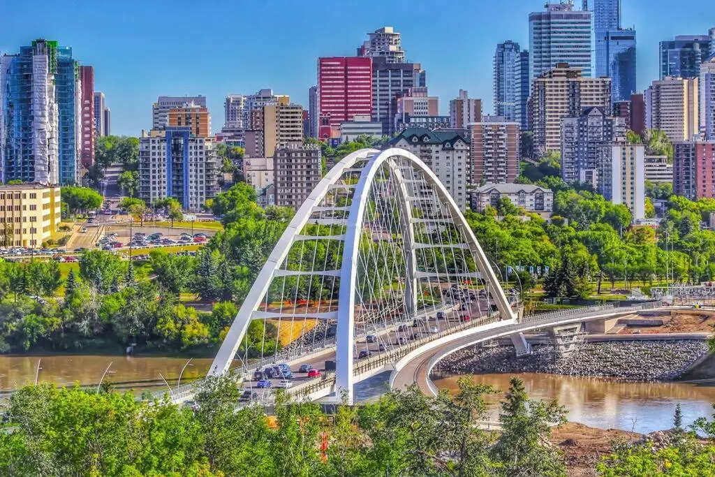 Walterdale Bridge in Edmonton, Alberta, spanning the North Saskatchewan River with the downtown skyline in the background.